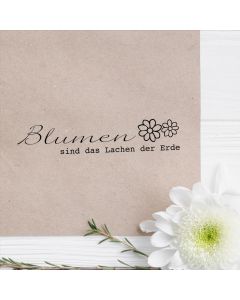 Holzstempel mit Abdruck: Blumen sind das Lachen der Erde  